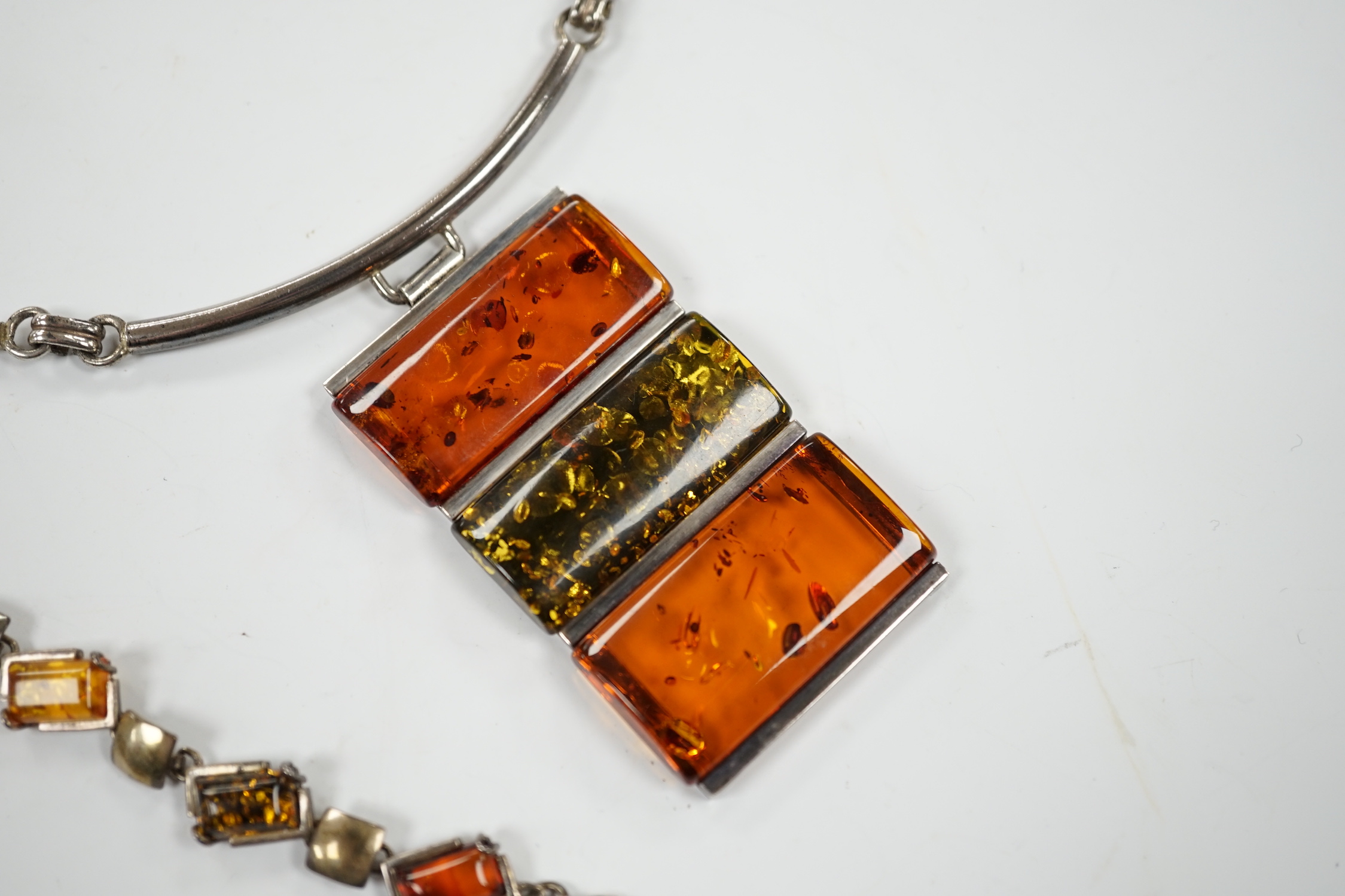 A modern 925 and three stone amber set pendant necklace, 42cm, together with a similar bracelet and pair of drop earrings.